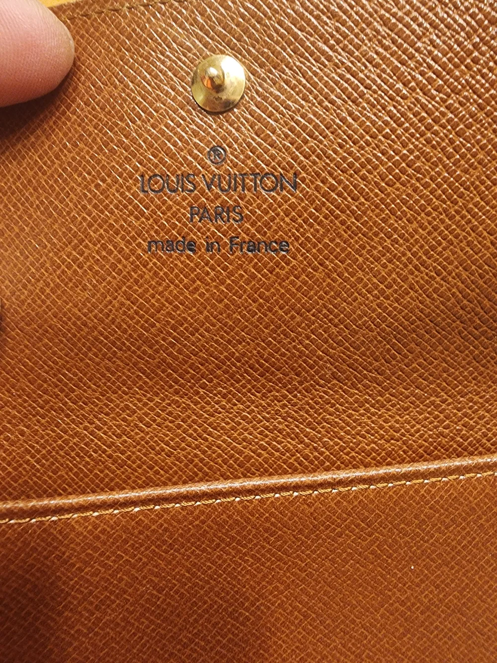 vintage Louis Vuitton Monogram Elise Wallet crafted in the classic brown LV